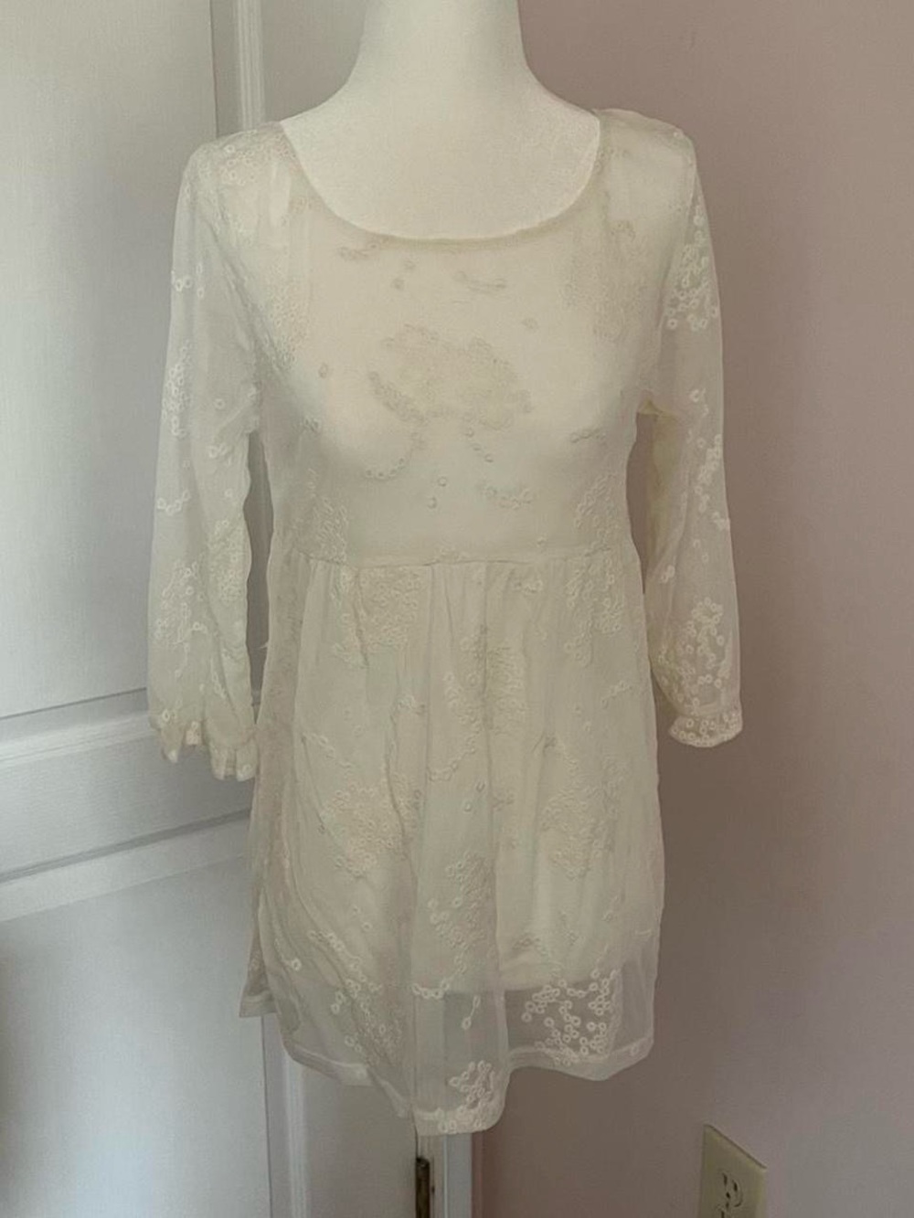 sheer white lace eyelet babydoll top with 3/4 sleeves and a flowy fit